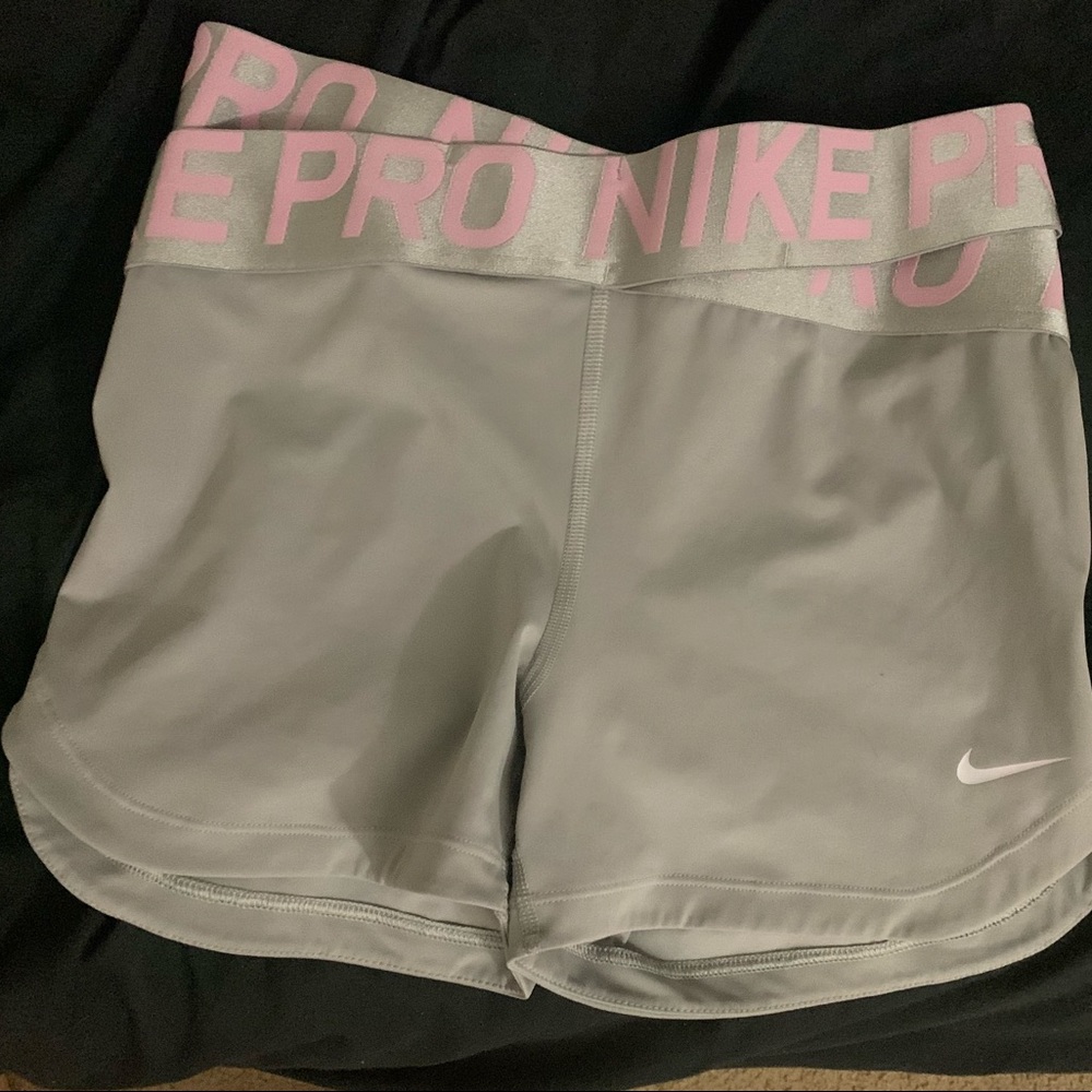 Grey and pink Nike Dri-fit pro spandex shorts